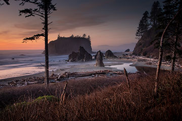 A beach scene at dusk