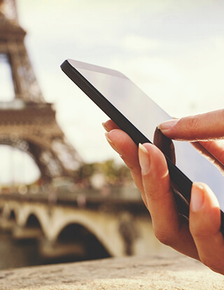 Image of walking with phone in Paris