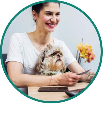 lady with dog buying something