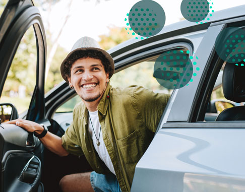 man driving a car smiling
