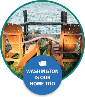 Two Adirondack chairs look out over a bay. Text below reads “Washington is our home too.”