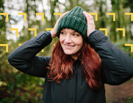 Woman wearing a beanie, smiling