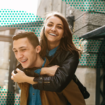 A man giving a woman a piggy-back ride.