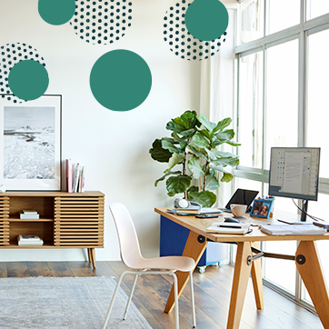 A desk with a chair and computer