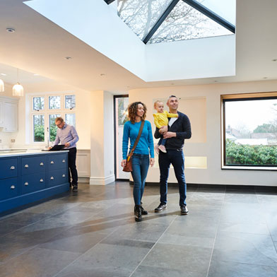 Family standing in new home