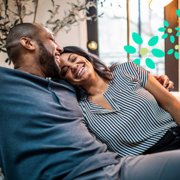 A couple having a laugh while hugging