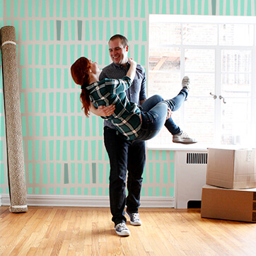 A little girl riding piggy back on her dad's shoulder