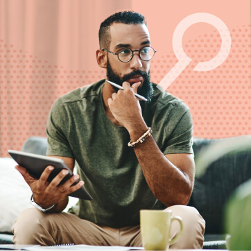 Bearded man with round glasses in a pondering pose holding a tablet on one hand and a pen on the other.