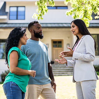 Couple talking with realtor