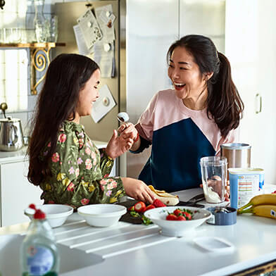 woman and daughter cooking