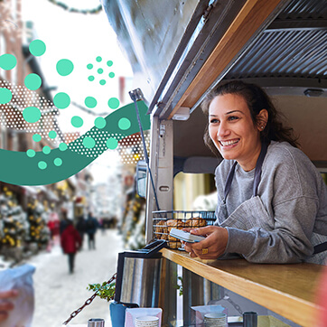 Woman in a food truck smiling