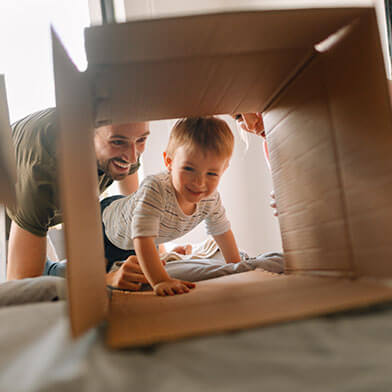 Baby playing inside a box