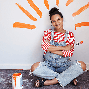 woman painting her house