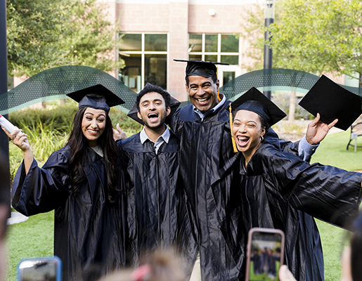 A graduate with his family taking a picture with his phone