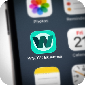 The WSECU Business app icon shown on a phone screen