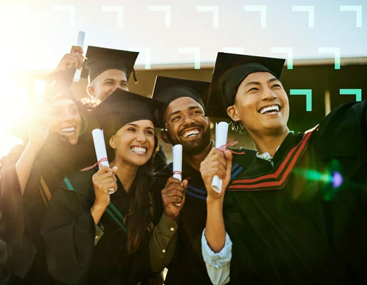 People holding diplomas in graduation cap and gowns.